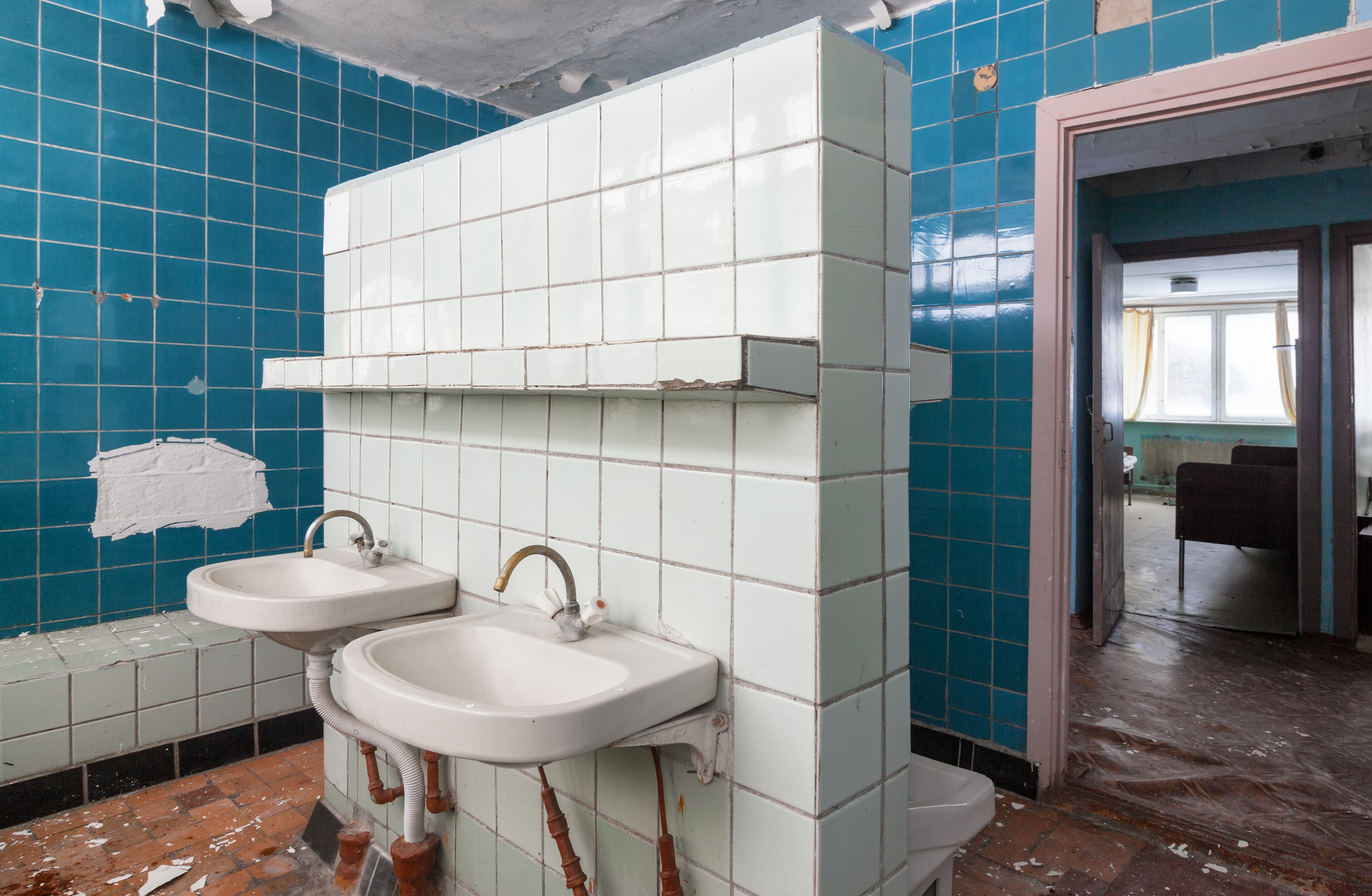 Bathroom with wash hand basin in the abandoned building of the children’s pioneer camp Bathroom with wash hand basin in the abandoned building of the children's pioneer camp