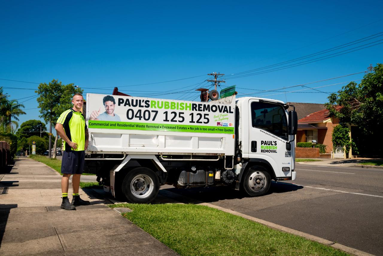 pauls rubbish removal truck and worker