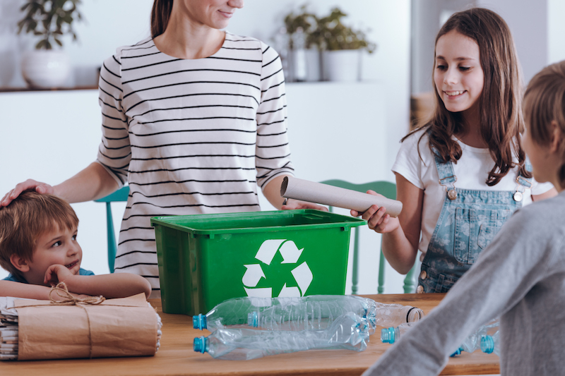 Mother teaching how to recycle