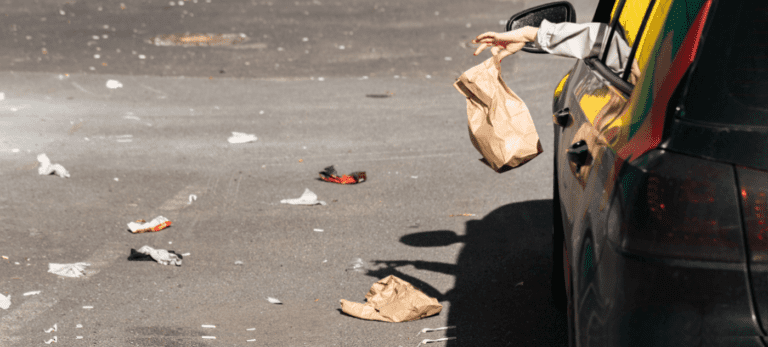 Driver Throwing Out Paper Bag