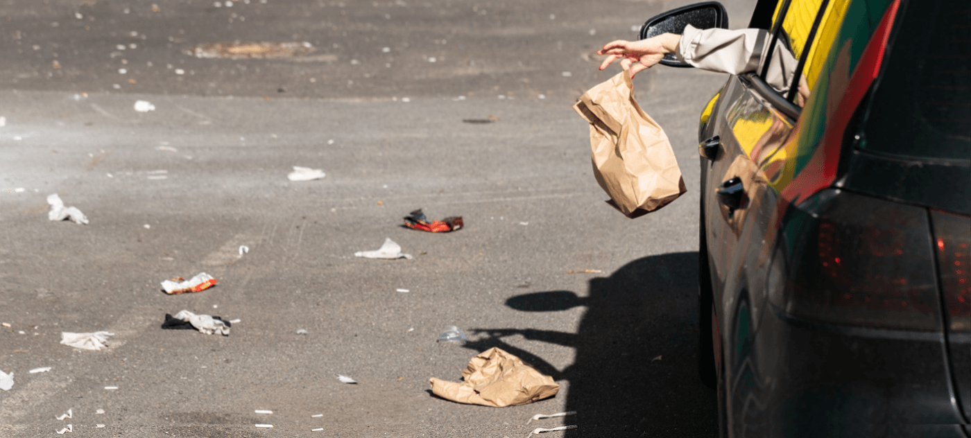 Driver Throwing Out Paper Bag