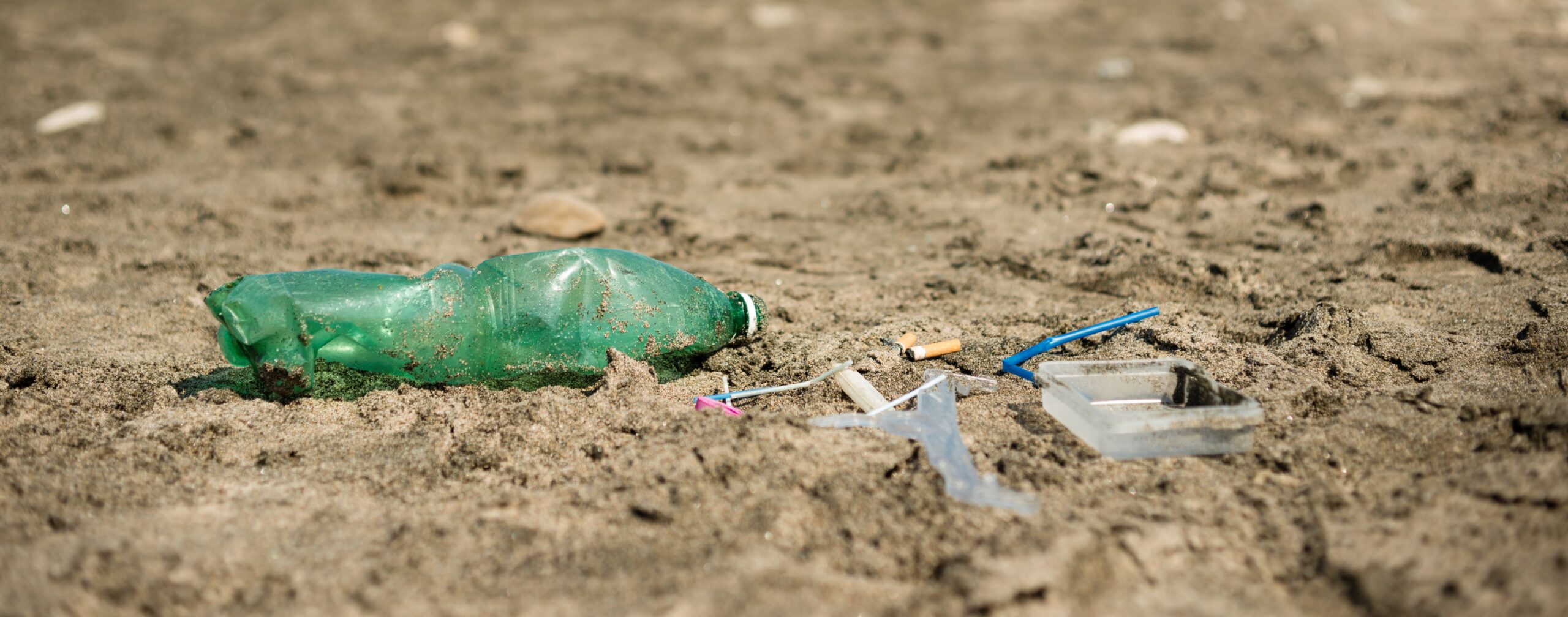 Plastic garbage left on a sandy beach