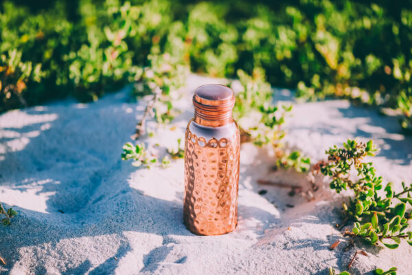 Copper Water Bottle In Sunlight